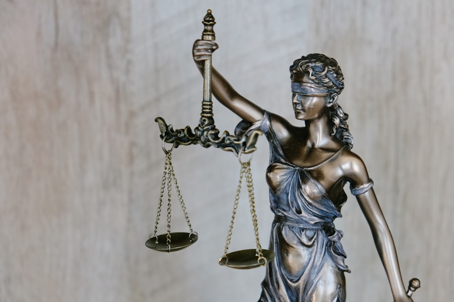 A bronze scales-of-justice figure, representing Hong Kong employment law