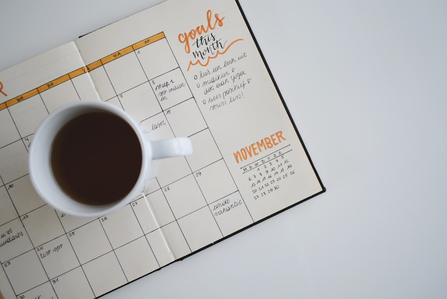A monthly planner and coffee cup, used to track contract renewal dates