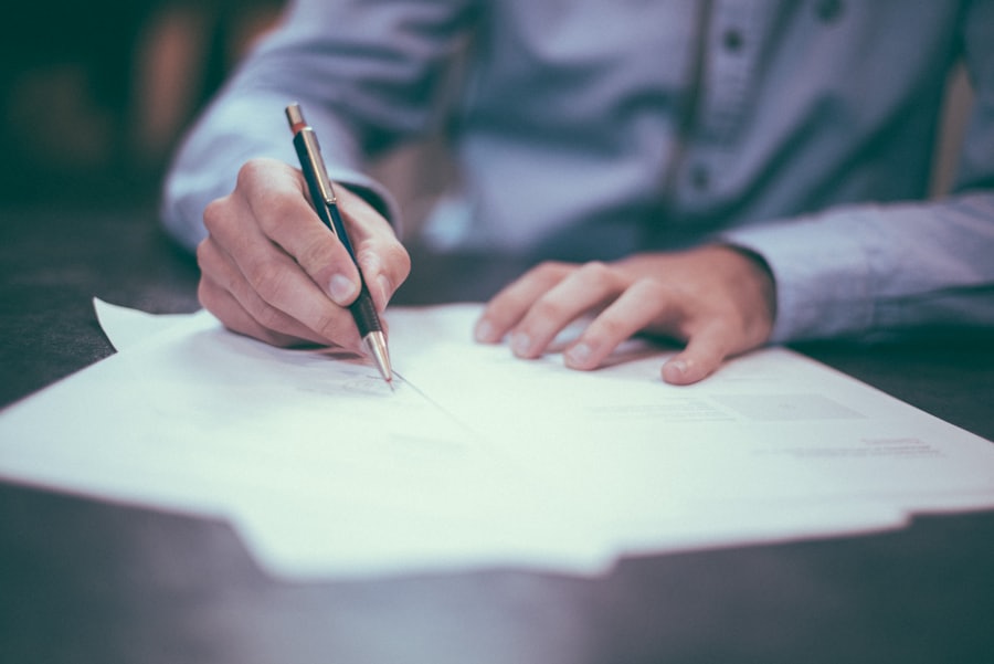 Signing employment documents at a desk